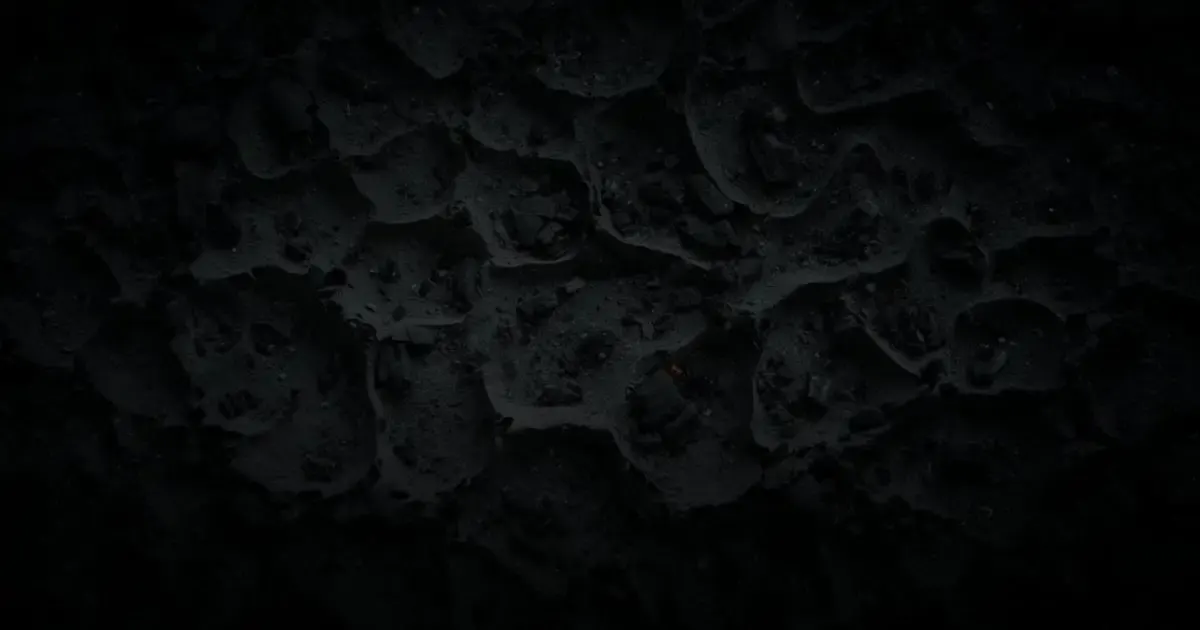 Rough, hand-worked dark metal still waiting to be shaped, like the repetitive intake and document handoffs law firm software takes on