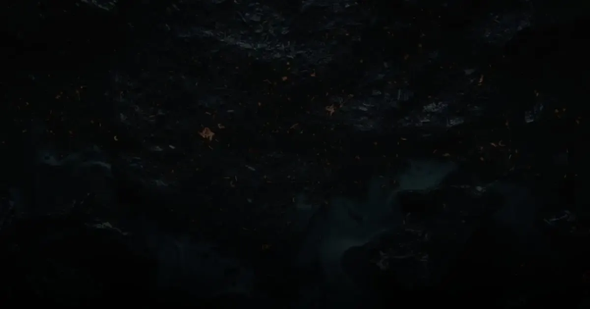 Scattered embers across dark forge coal under cool light, like the rough handoffs automotive service scheduling software smooths out