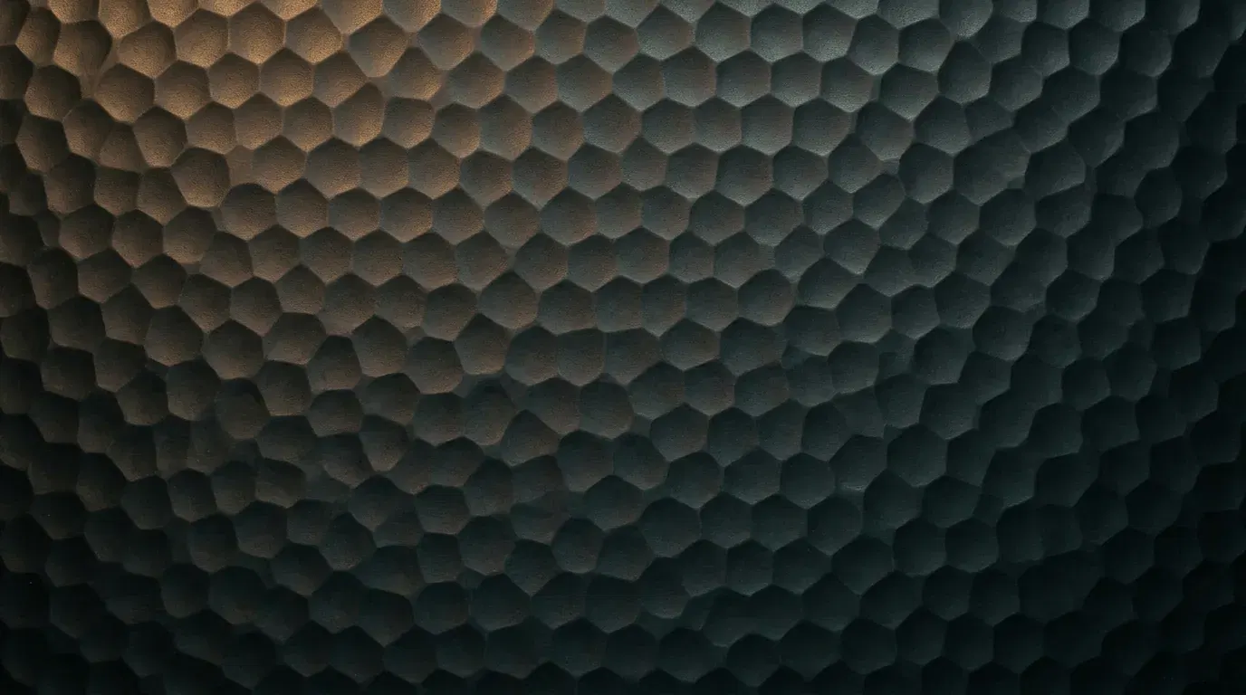 Rows of small hammer marks across dark steel