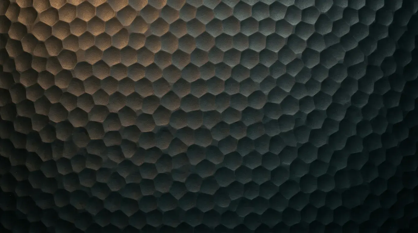 Rows of small hammer marks across dark steel