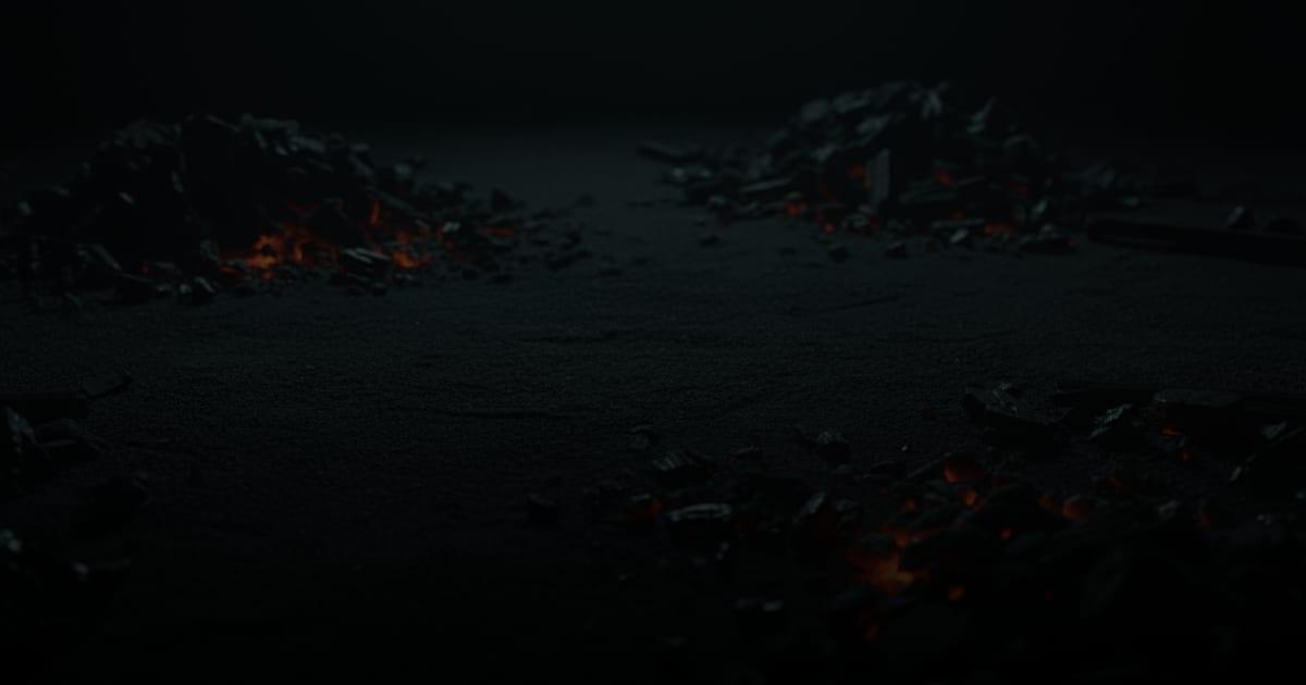 Patches of orange heat beneath scattered dark coals