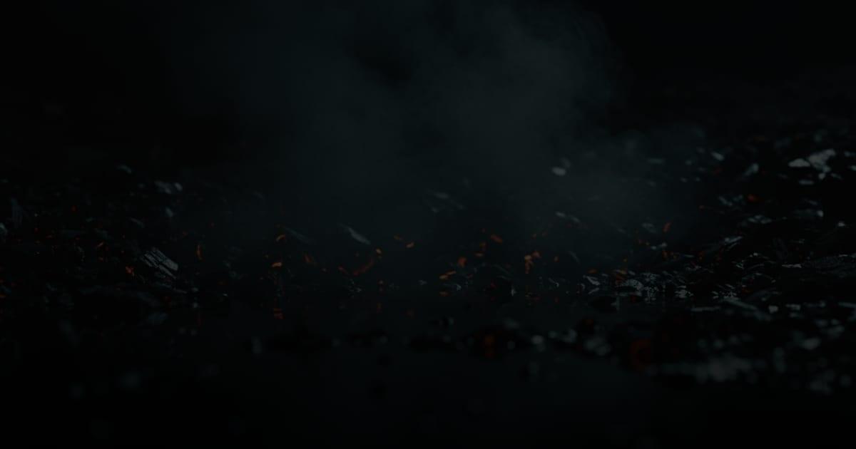 Steam drifting over dark forge coal flecked with embers, illustrating the website redesign results Cincinnati businesses should measure